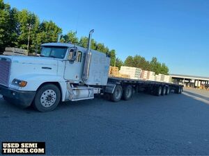 1997 Freightliner FLD Sleeper Truck with Flatbed Trailer.