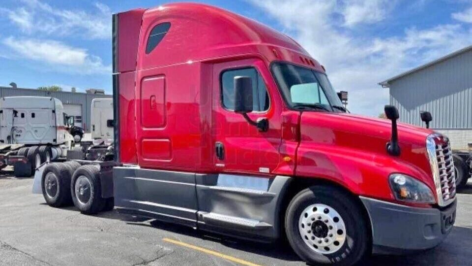 A red 2018 Freightliner Cascadia sleeper truck