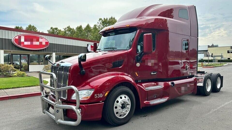 A red 2022 Peterbilt 579 sleeper truck