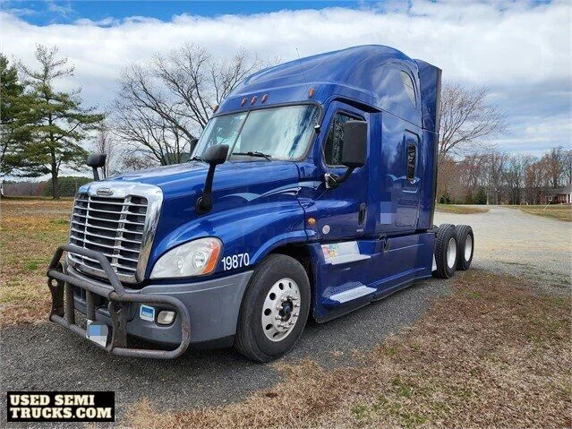 A blue Freightliner Cascadia semi truck with automatic transmission