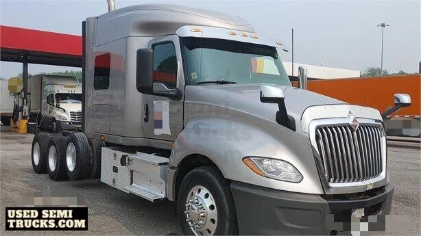 A grey International LT625 semi truck with automatic transmission