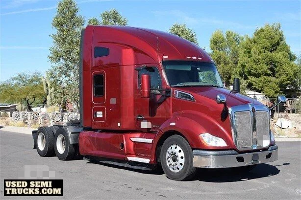 A red Kenworth T680 semi truck with automatic transmission